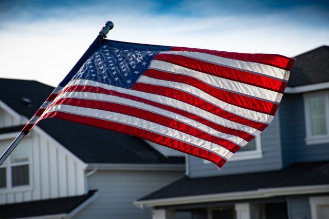 American Flag in front of homes