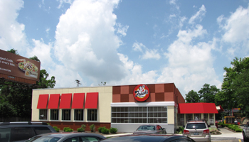 frisch's big boy building with a blue sky and white clouds