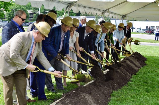 Bluegrass Care Navigators: group of people with hard hats and shovels digging in the ground